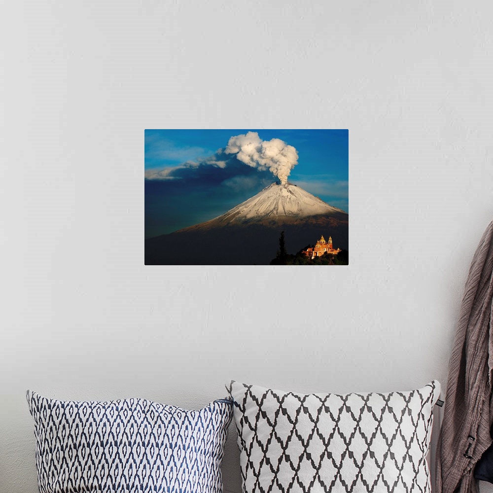 A bohemian room featuring Clouds of ash rising from snowy  Popocatepetl volcano, Mexico.