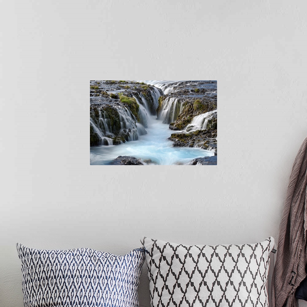 A bohemian room featuring Group of several waterfalls with glacial water in South Iceland.