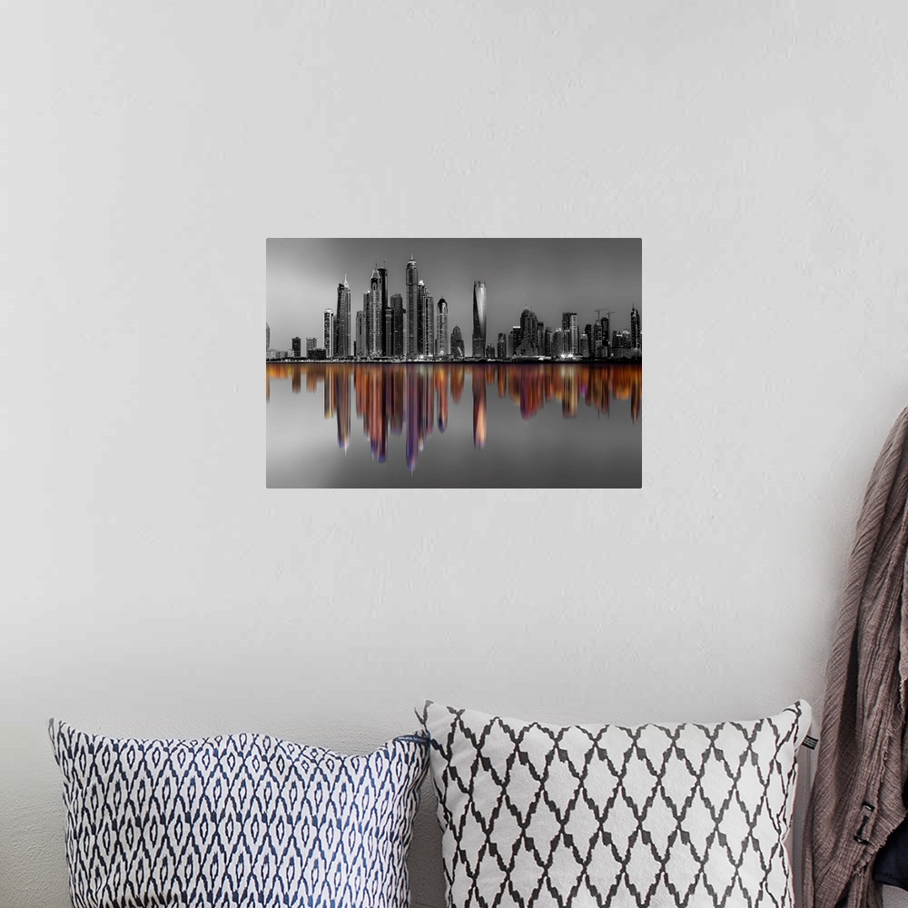 A bohemian room featuring Black and white image of hte Marina Towers in Dubai, with a reflection in color.