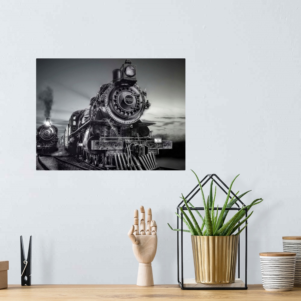 A bohemian room featuring Black and white photograph of trains on a railroad together.