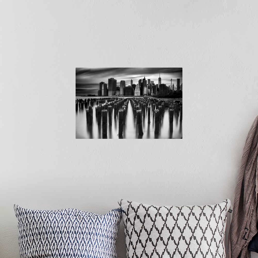 A bohemian room featuring New York City skyline seen from the harbor, in black and white.