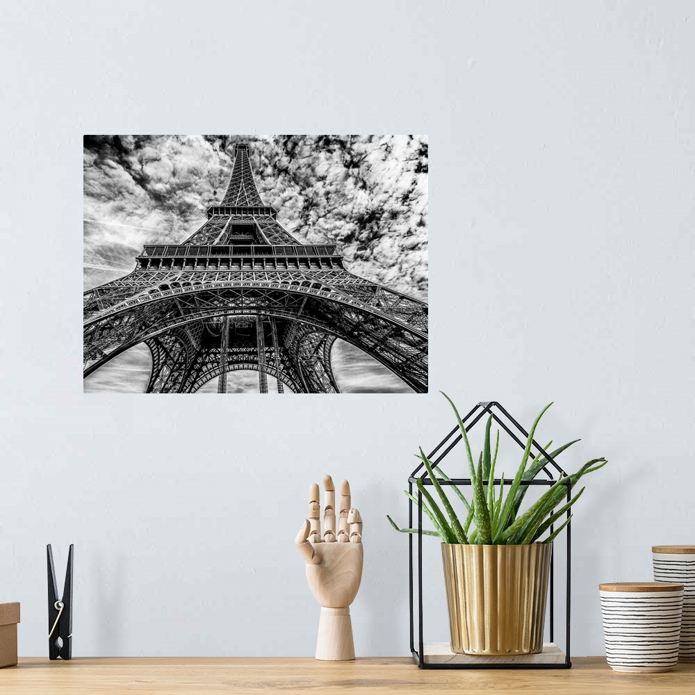 A bohemian room featuring High contrast black and white photo of the Eiffel Tower.