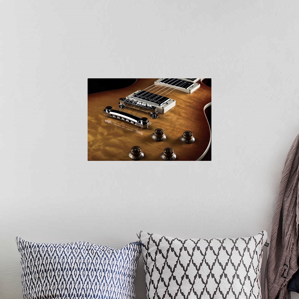 A bohemian room featuring Close up of an electric guitar.