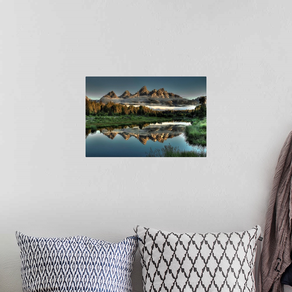 A bohemian room featuring A unique morning at Schwabacher's landing, with two rows of clouds under the mountain peaks.