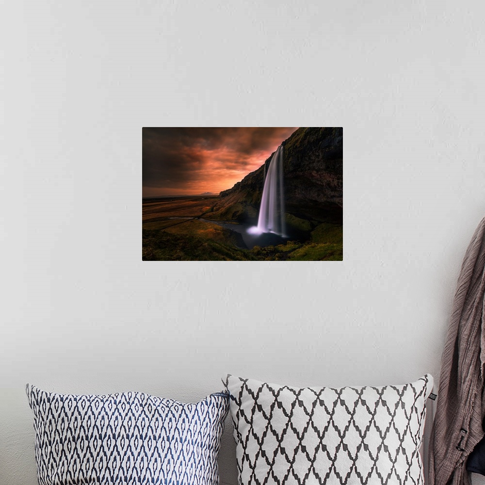 A bohemian room featuring Seljalandsfoss Waterfall in Southern Iceland in the evening.
