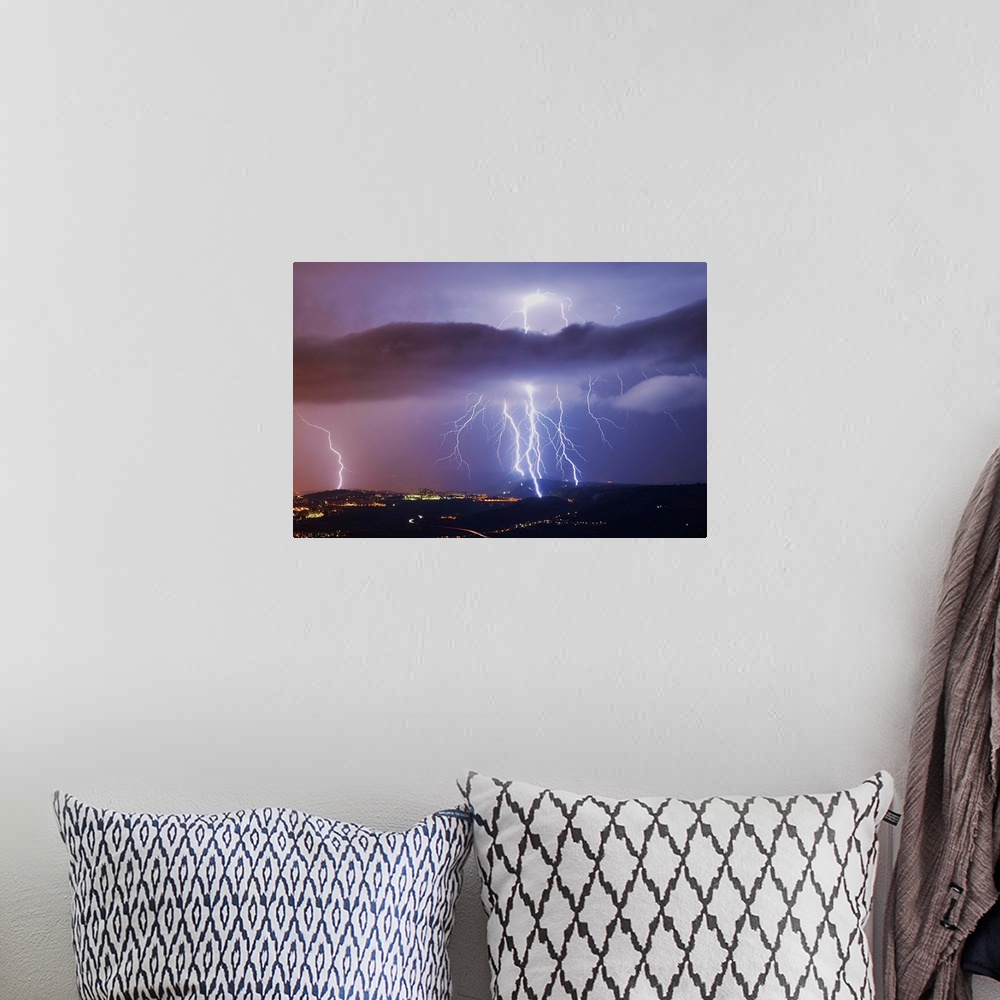 A bohemian room featuring This is a single exposure image of several consecutive lightning strikes into hills above Trieste...