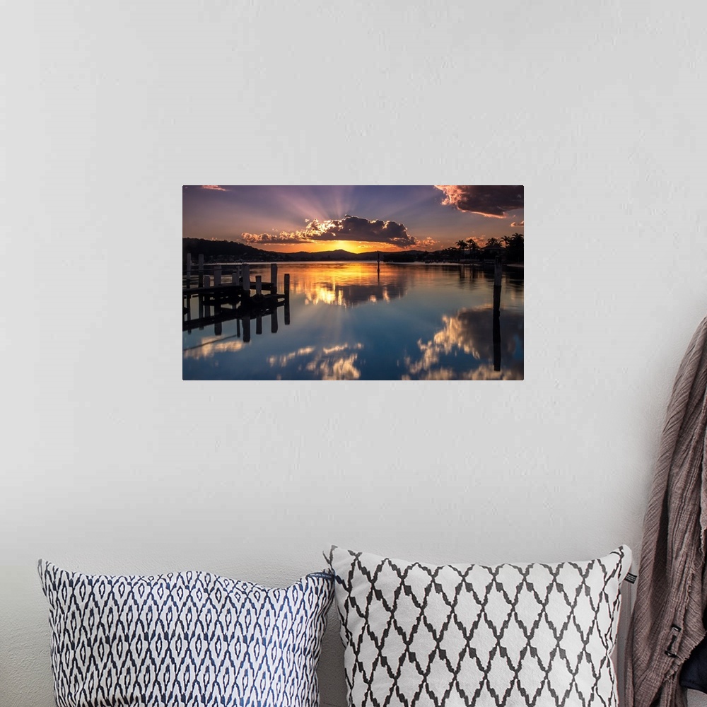 A bohemian room featuring A beautiful sunset with a crown cloud at Brisbane waters, Blackwall, Central Coast, NSW, Australia.