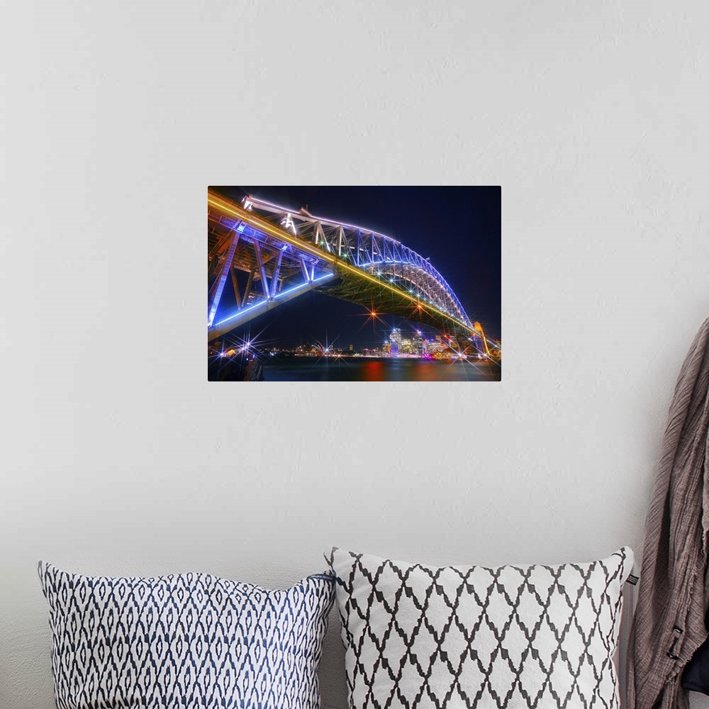 A bohemian room featuring Photograph of the Sydney Harbor skyline from under the massive neon lit bridge.