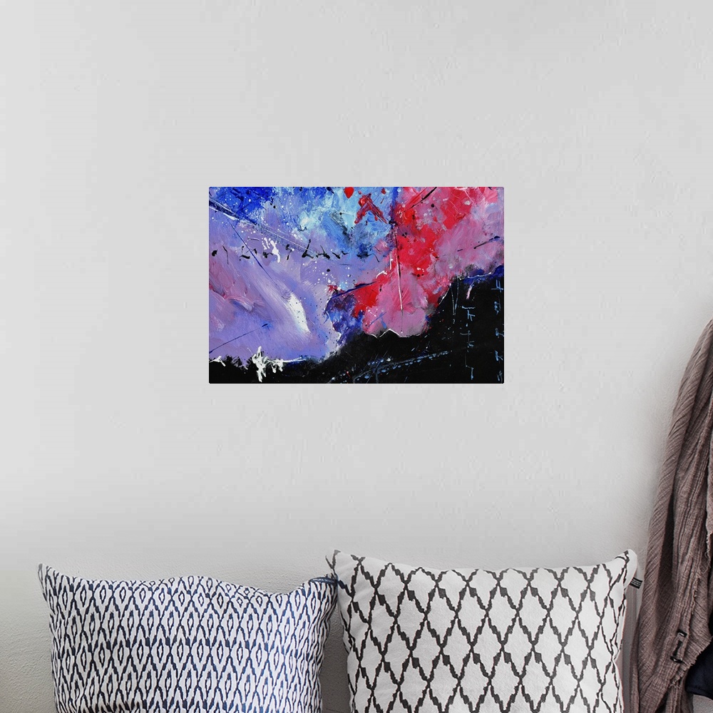 A bohemian room featuring Abstract painting in shades of black, blue, red and purple with splatters of paint overlapping.