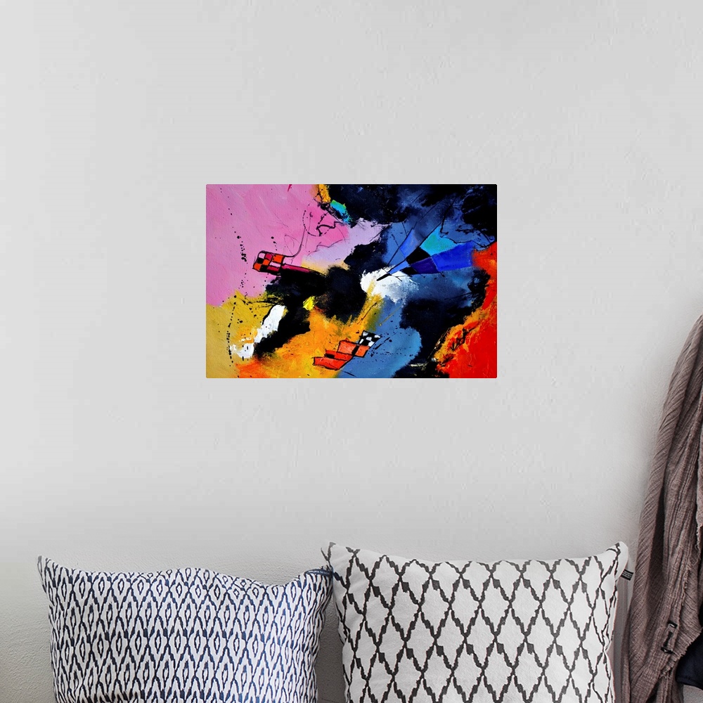 A bohemian room featuring A horizontal abstract painting in vibrant shades of blue, pink, red and yellow with splatters of ...
