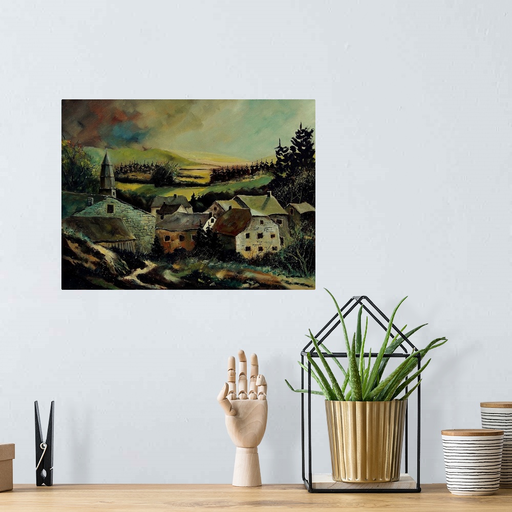 A bohemian room featuring A low pitched painting of a village in Belgium.