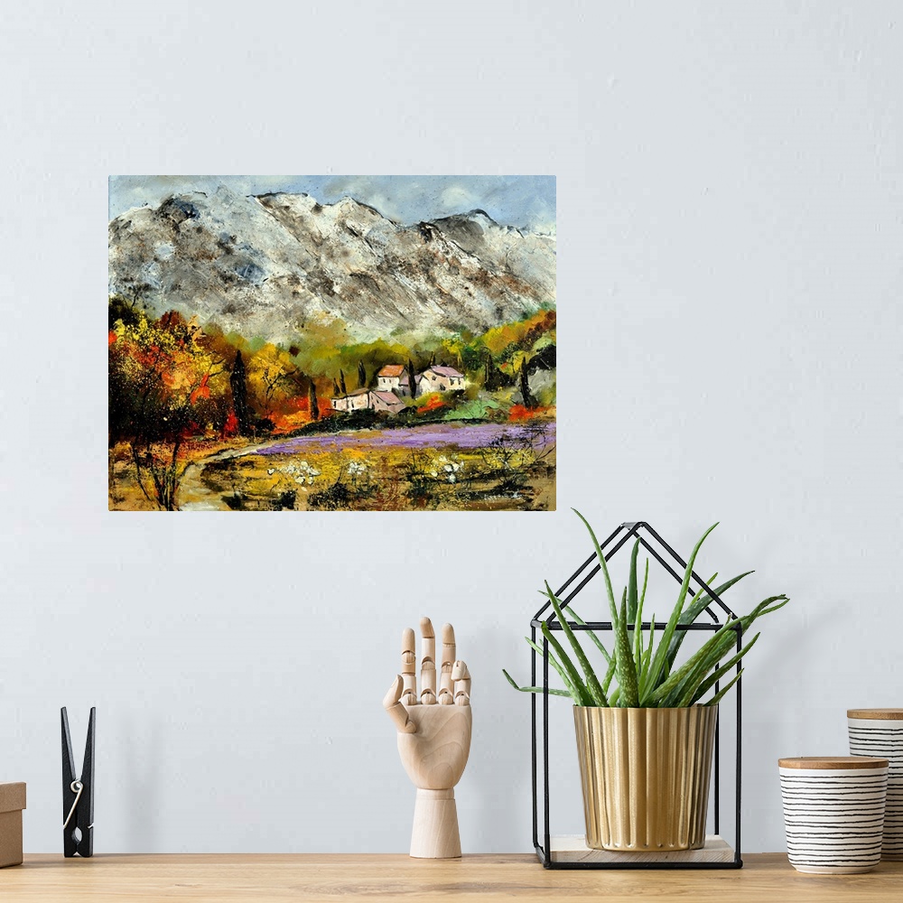 A bohemian room featuring A scenic landscape of houses along the valley of snow covered mountains.