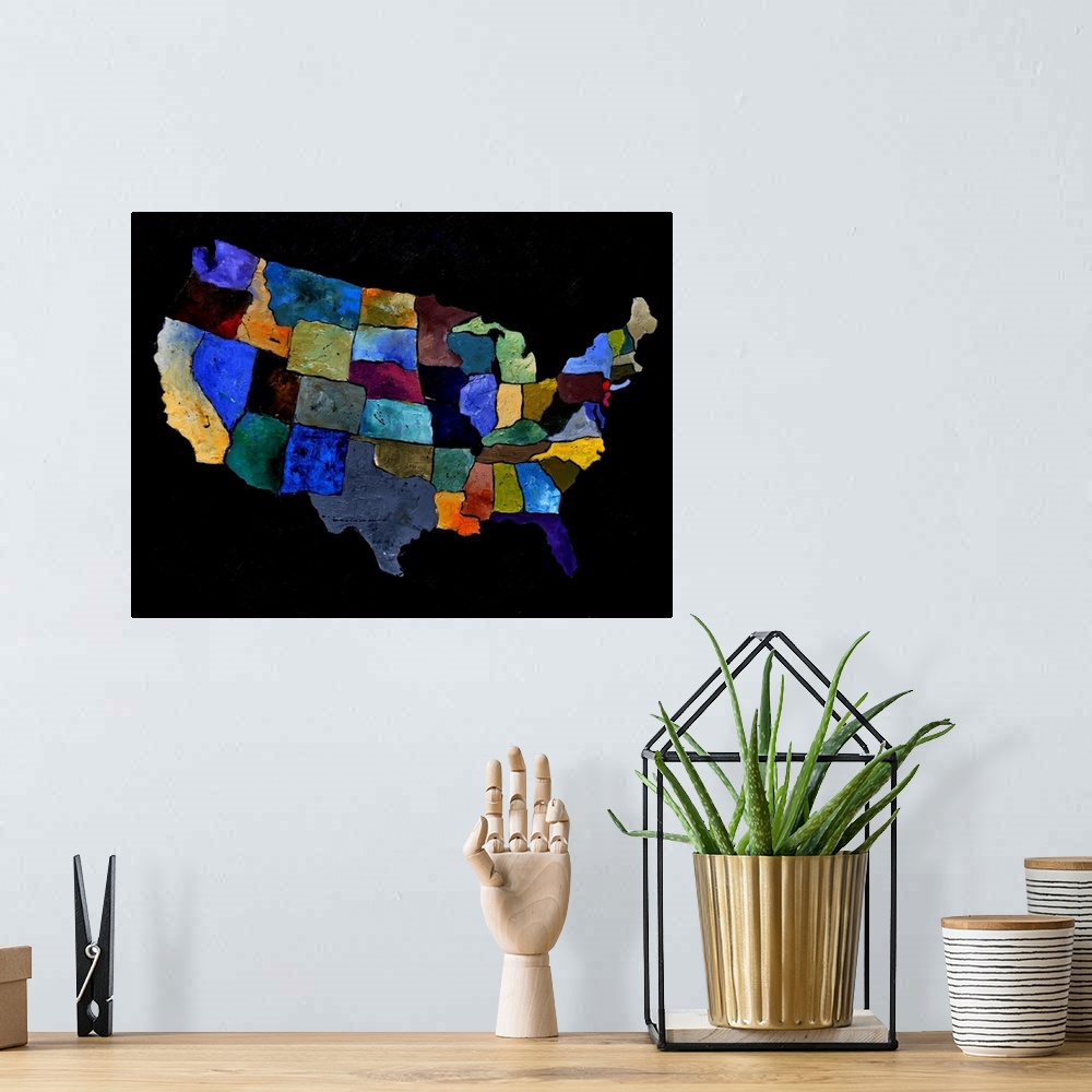 A bohemian room featuring Painting of the United States of America in multi-color paints against a black background.