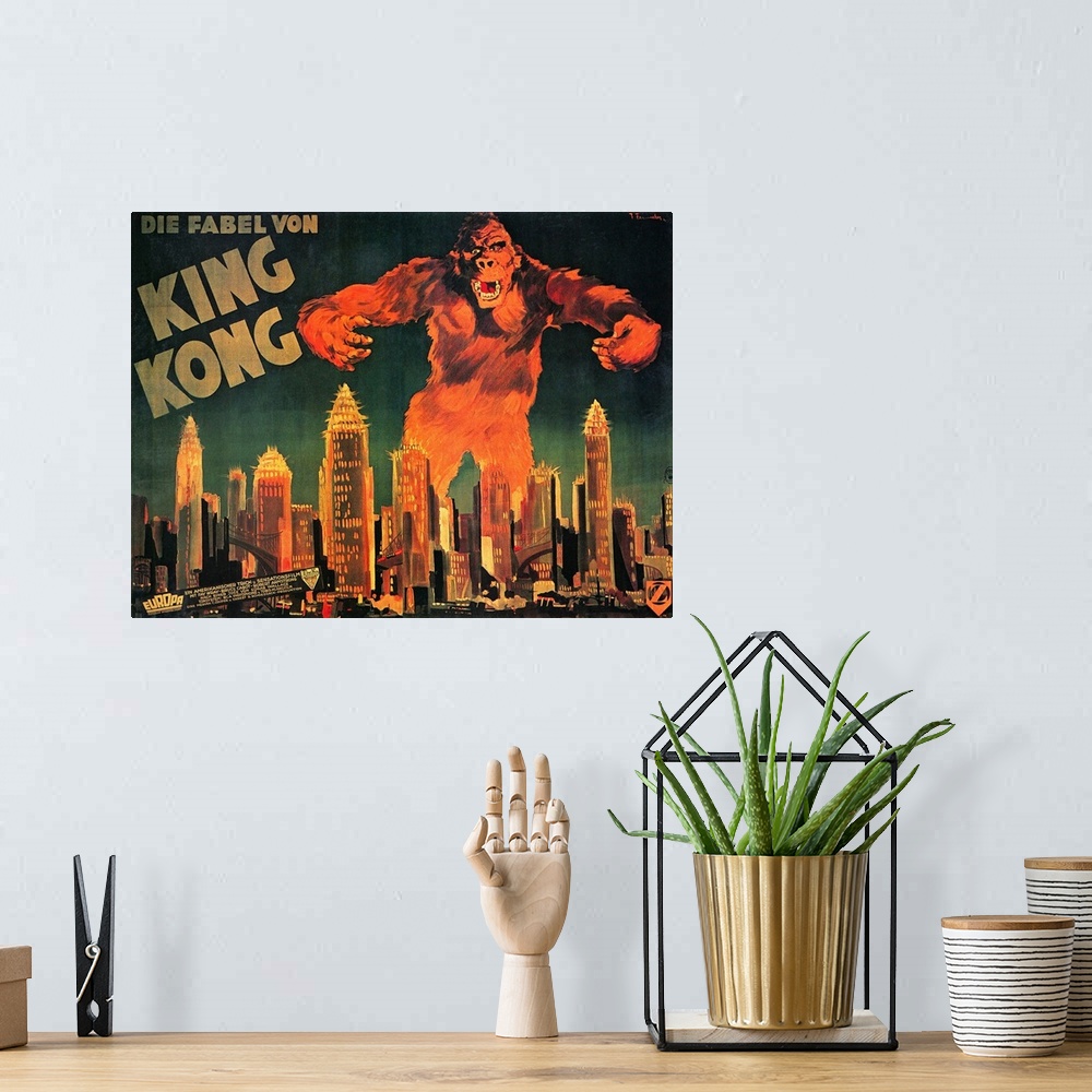 A bohemian room featuring Large landscape vintage artwork of King Kong, as the large ape towers over the skyscrapers in a c...