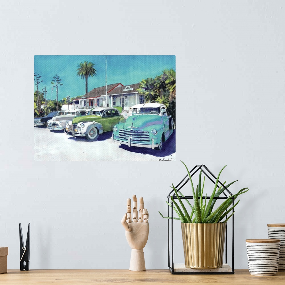 A bohemian room featuring Contemporary painting of vintage cars parked outside in Old Town San Diego, California.