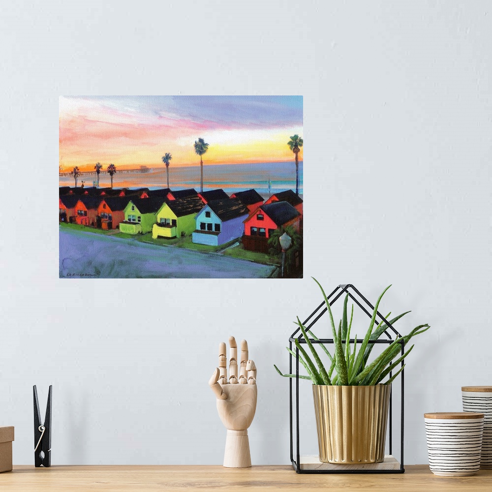 A bohemian room featuring Painting of the sunrise over Oceanside California with Roberts multicolored Cottages and Oceansid...