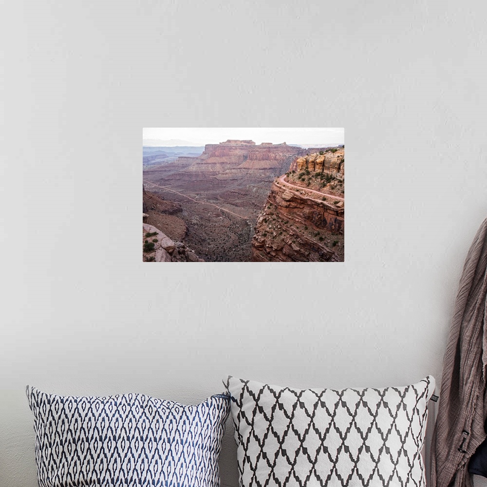 A bohemian room featuring View of the rocky desert landscape with mesas in the distance, seen from Shafer Trail in Canyonla...