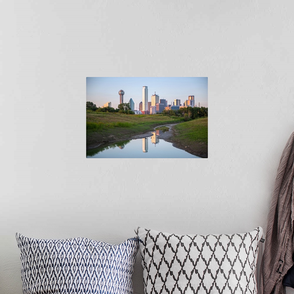 A bohemian room featuring A creek in the foreground of the Dallas Texas skyline.