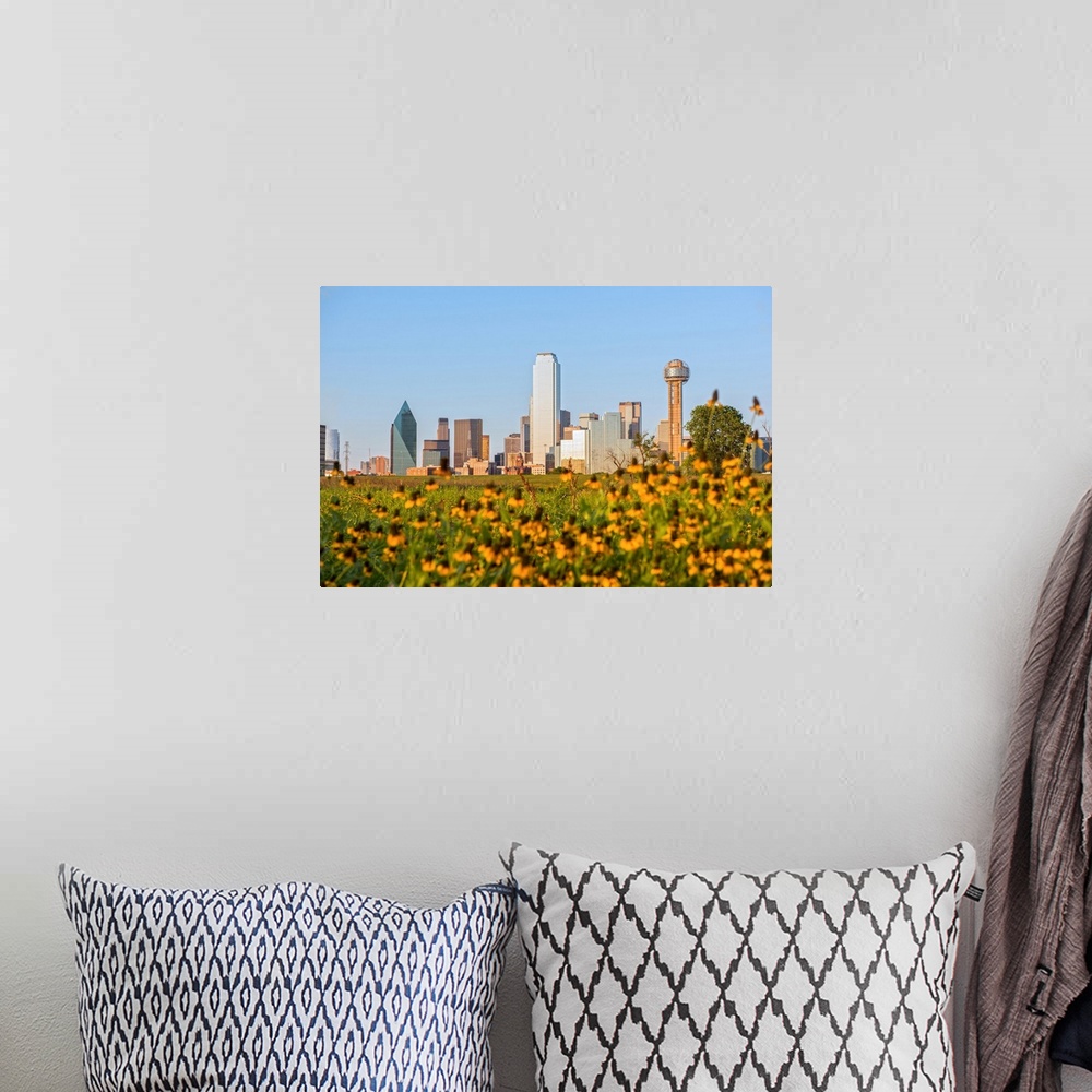 A bohemian room featuring A field of wild flowers in the foreground of the Dallas Texas skyline.