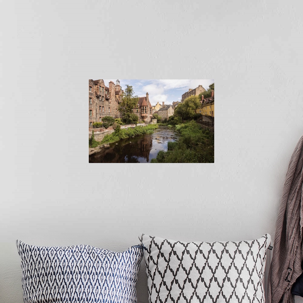 A bohemian room featuring Landscape photograph of picturesque Dean Village on the Water of Leith in Edinburgh.