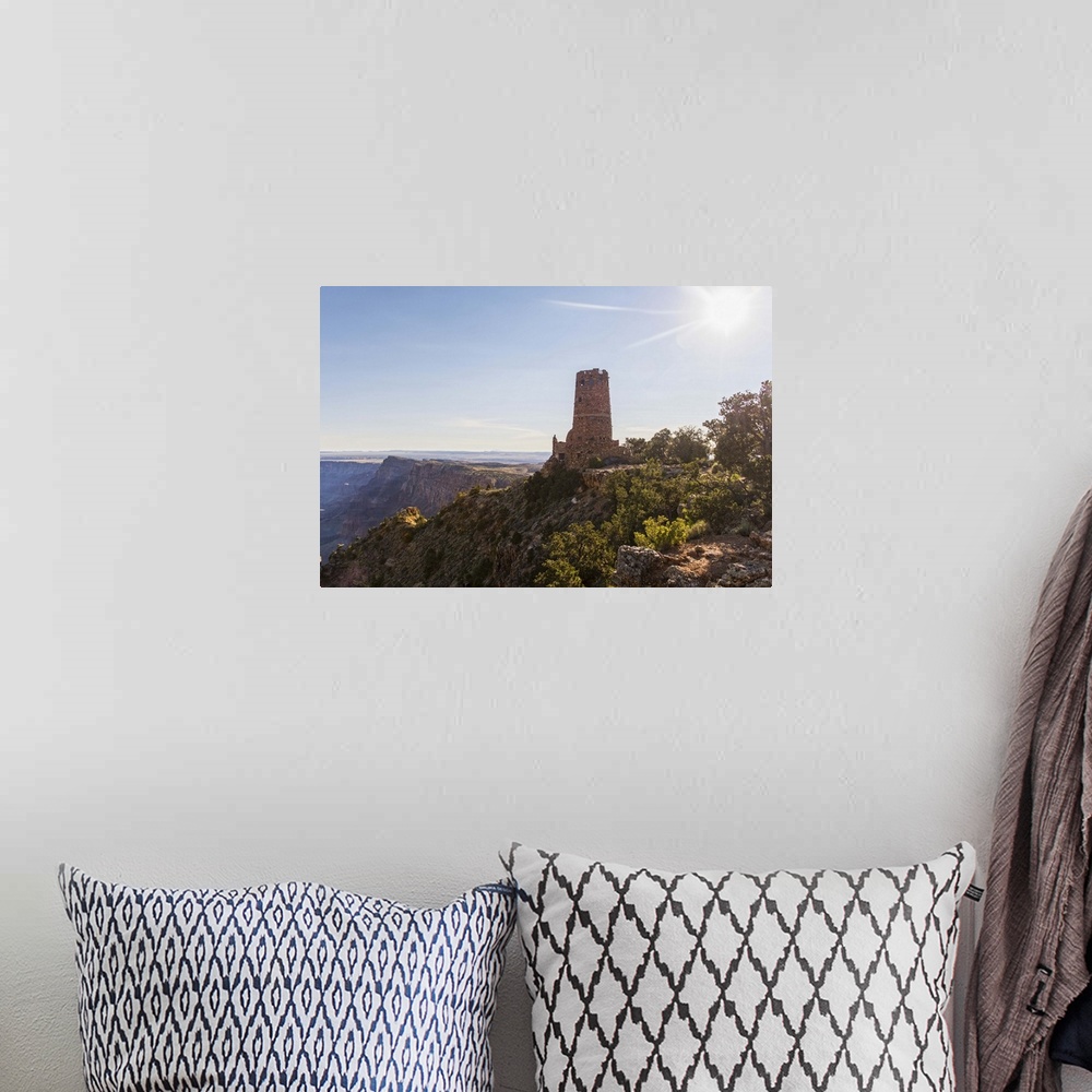 A bohemian room featuring Photograph of the Desert View Watchtower surrounded by canyon views.