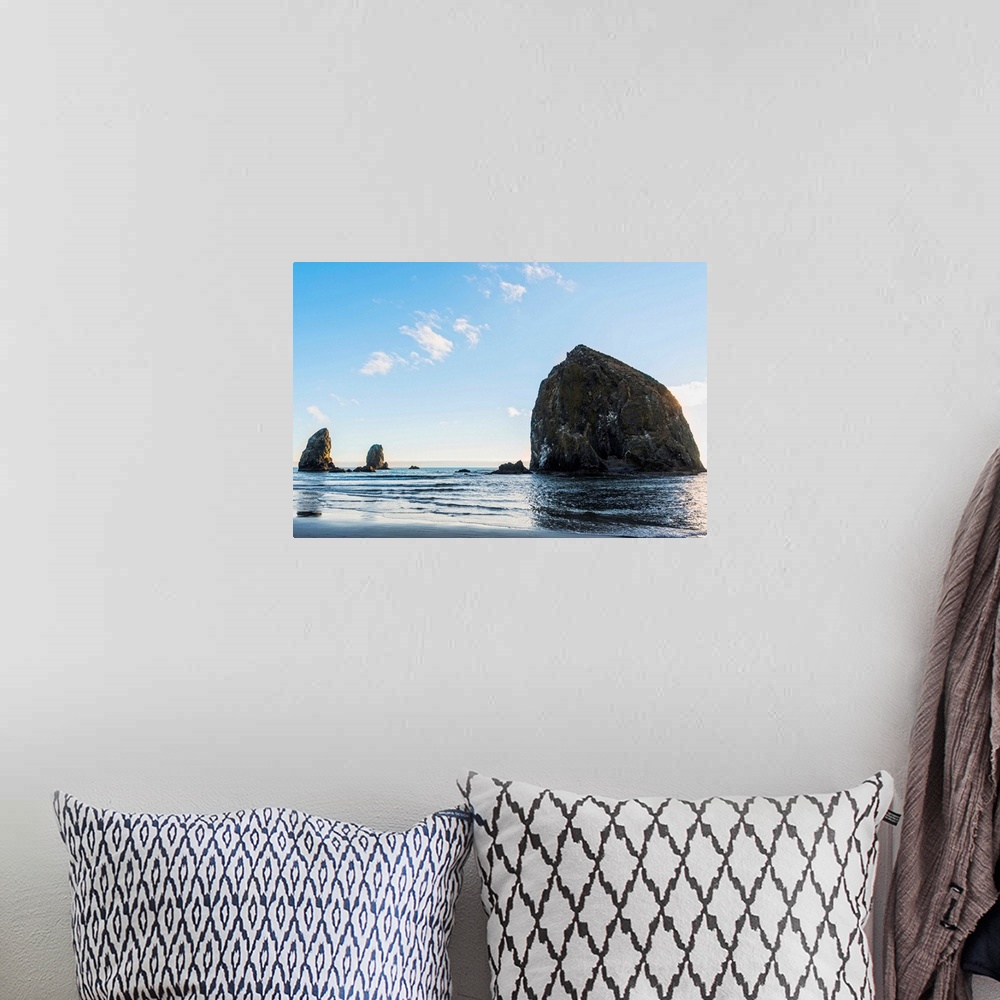 A bohemian room featuring Photograph of Haystack Rock at Cannon Beach with blue skies.