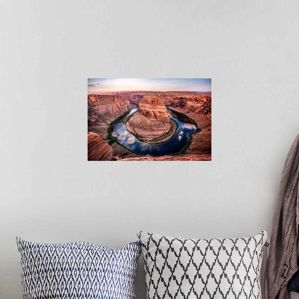 A bohemian room featuring Landscape photograph of Horseshoe Bend in Page, Arizona with blue cloudy skies reflecting into th...