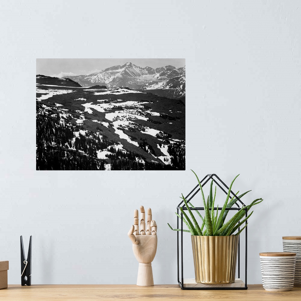 A bohemian room featuring Long's Peak, Rocky Mountain National Park, panorama of plateau, snow covered mountain in background.