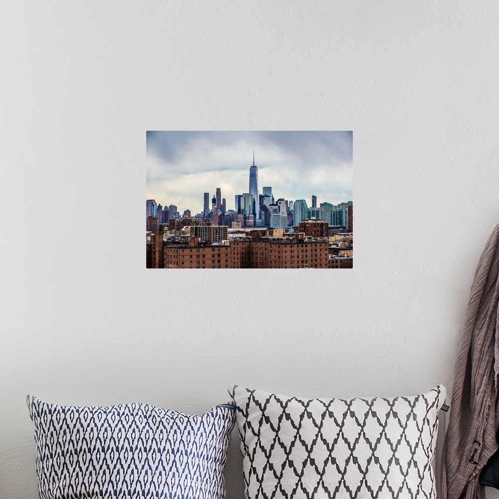 A bohemian room featuring View of the New York City skyline over Manhattan with cloudy skies.