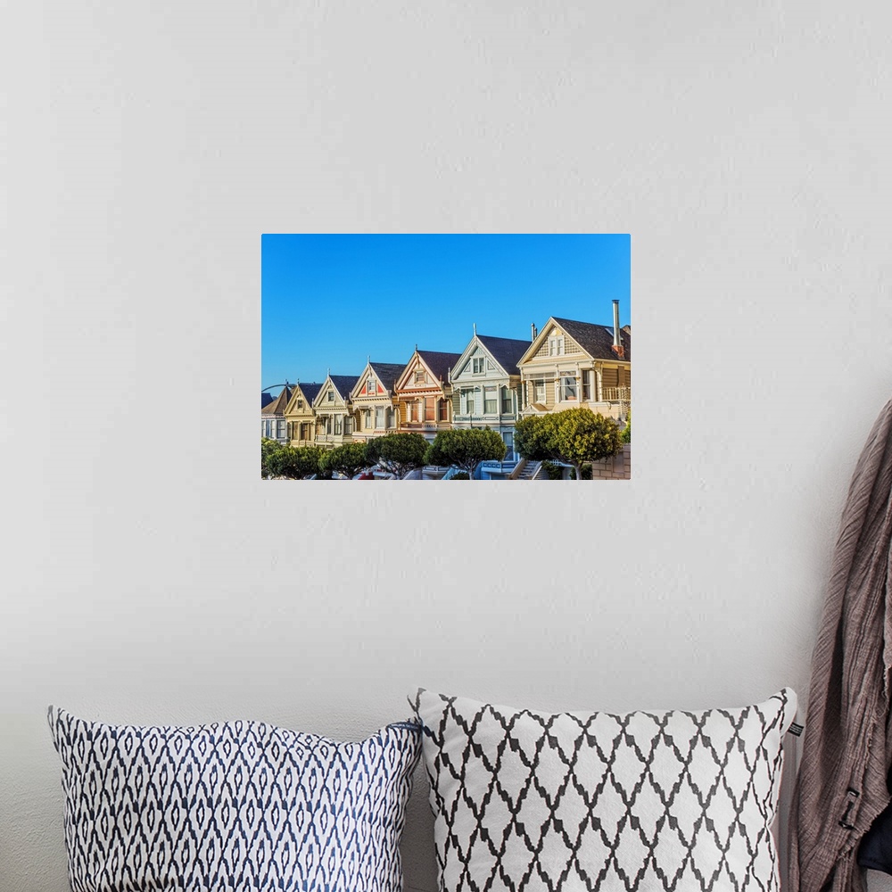 A bohemian room featuring Photograph of the Painted Ladies in downtown San Francisco with a bright blue sky above.