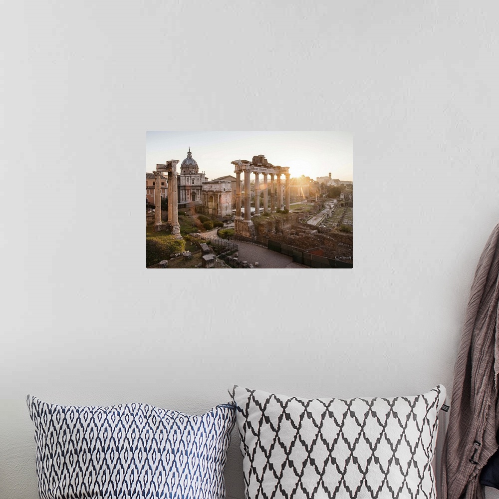 A bohemian room featuring Photograph of the ruins at the Roman Forum with the sun shining in the background.