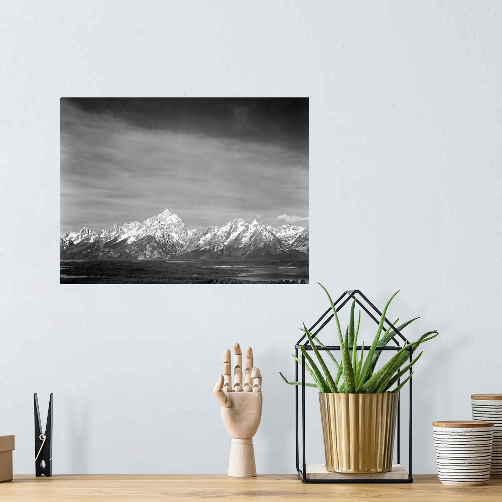 A bohemian room featuring Tetons from Signal Mountain, valley, snow-capped mountains, low horizons.