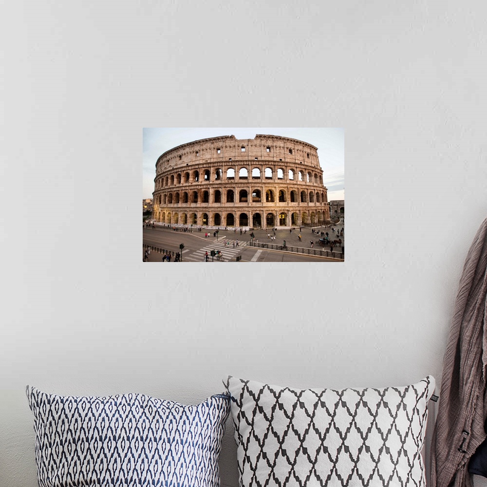 A bohemian room featuring Photograph of the Colosseum from across the street with tourists surrounding the grounds.