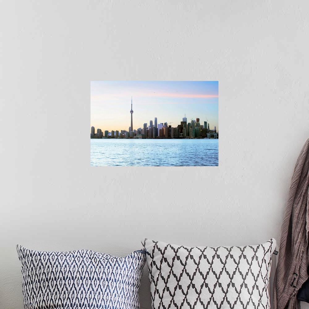 A bohemian room featuring Toronto city skyline with Lake Ontario in the foreground.