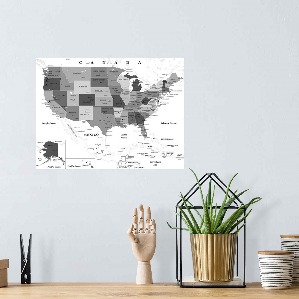 A bohemian room featuring Large black and white map of the United States of America with a classic font.