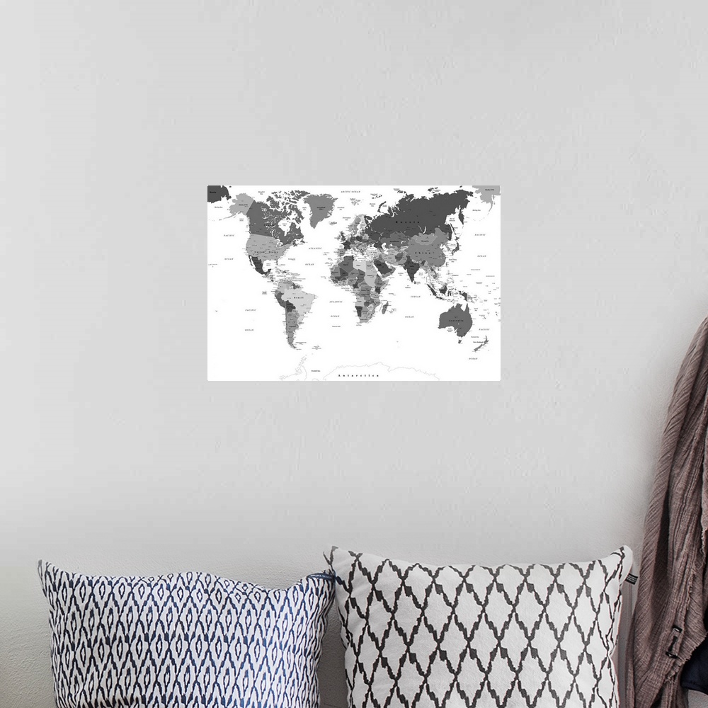 A bohemian room featuring Large black and white map of the World with a classic font.
