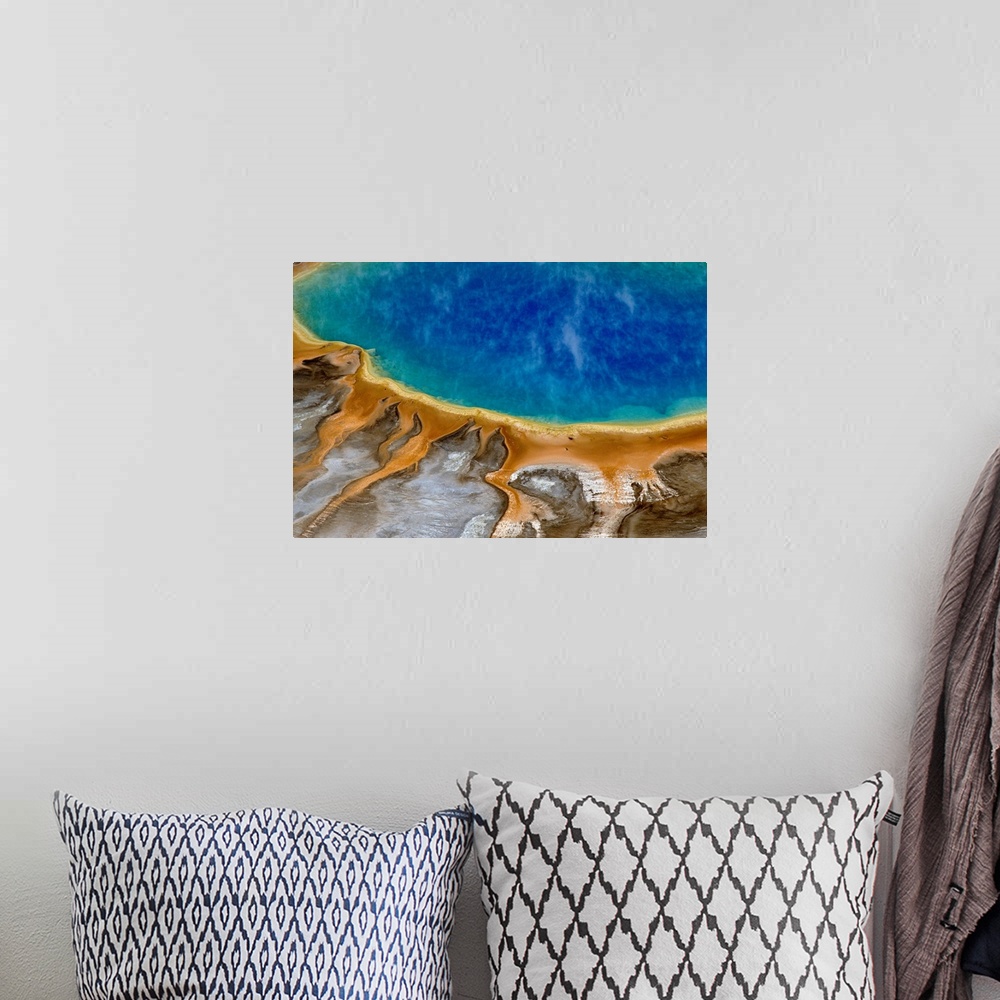 A bohemian room featuring Large image print of a spring  at Yellowstone National Park viewed from above.