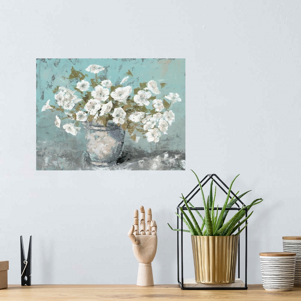 A bohemian room featuring A contemporary still life painting of a vase full of white bloomed flowers with a teal background.