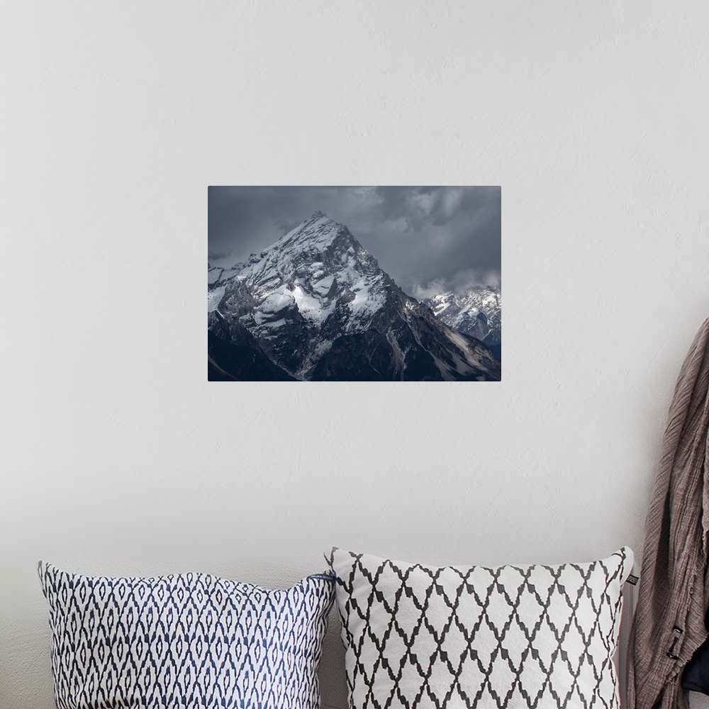 A bohemian room featuring Averau mountain covered by snow and with light rays filtering through clouds, Dolomites, Belluno,...