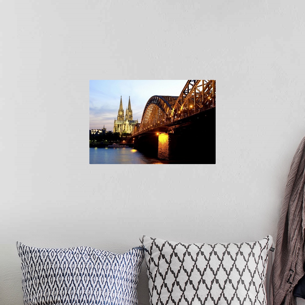 A bohemian room featuring Cologne cathedral and Hohenzollern bridge at night, Cologne, Germany