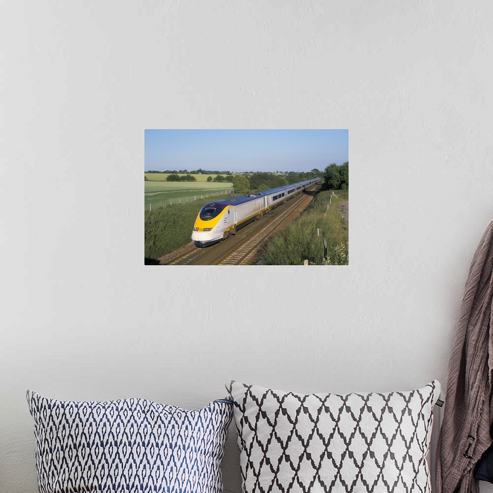 A bohemian room featuring Eurostar train travelling through countryside