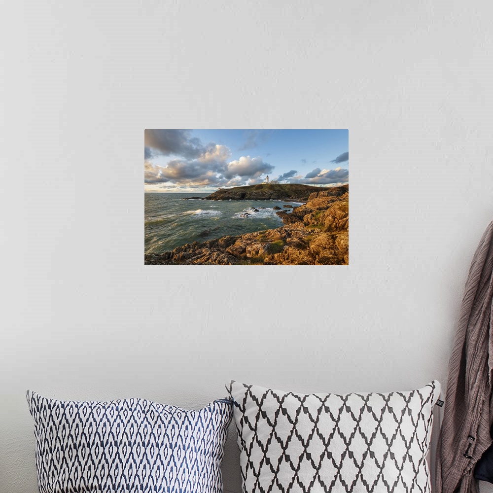 A bohemian room featuring Killantringan Lighthouse on Black Head and rocky coastline at sunset, Portpatrick, Dumfries and G...
