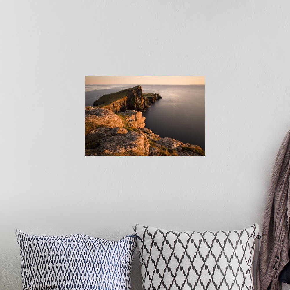 A bohemian room featuring Neist Point and Lighthouse bathed in evening light, Isle of Skye, Highland, Scotland