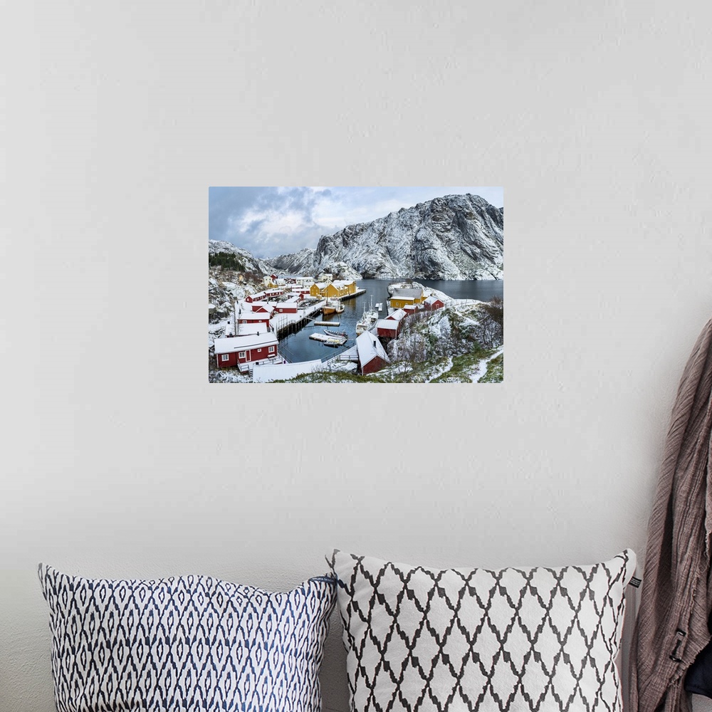 A bohemian room featuring Panoramic of the fishing village of Nusfjord and harbor covered with snow in winter, Nordland, Lo...
