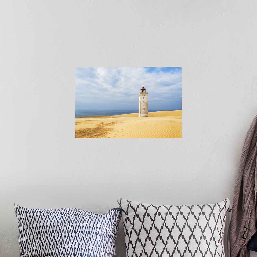 A bohemian room featuring Rubjerg Knude lighthouse surrounded by sand dunes, Jutland, Denmark, Europe