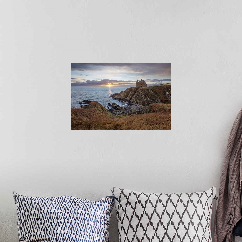 A bohemian room featuring Ruins of Dunskey Castle on rugged coastline at sunset, Portpatrick, Dumfries and Galloway, Scotla...