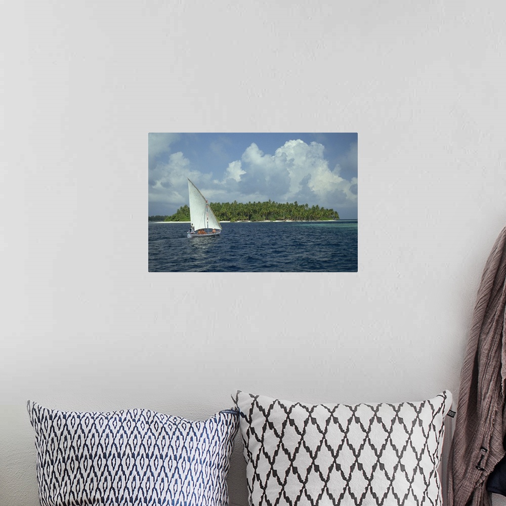 A bohemian room featuring Sailing boat off a tropical island in the Maldive Islands, Indian Ocean, Asia