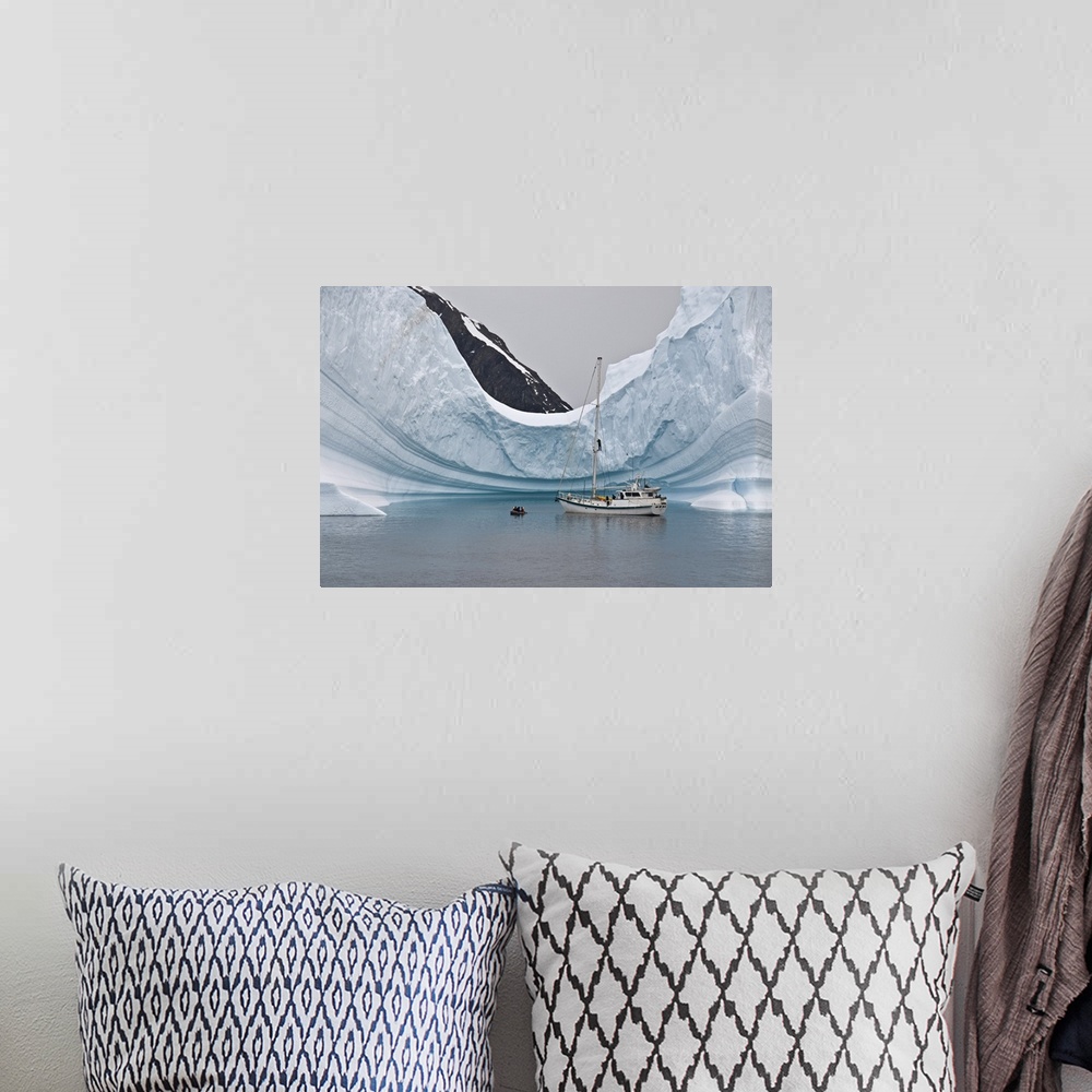 A bohemian room featuring Sailing yacht and iceberg, Errera Channel, Antarctica