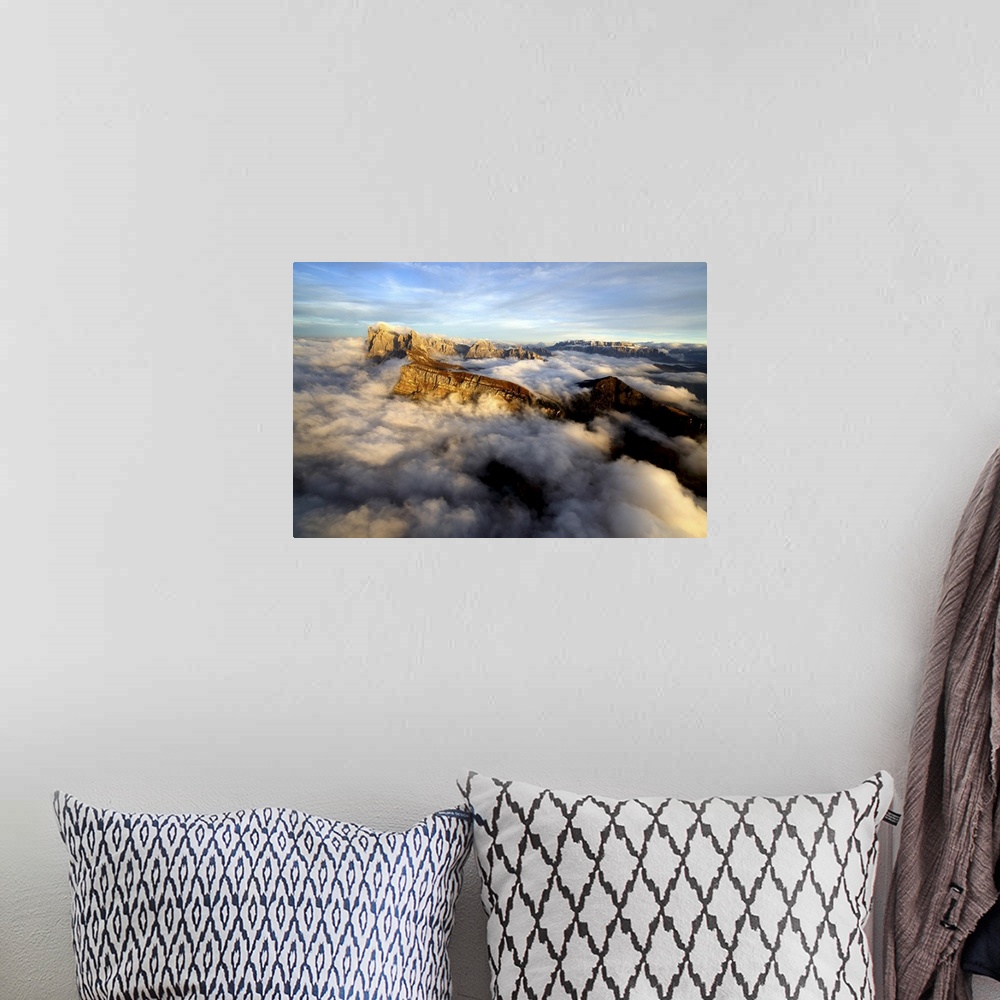 A bohemian room featuring Aerial shot from Seceda of Odle surrounded by clouds at sunset in the Dolomites, Val Funes, Trent...