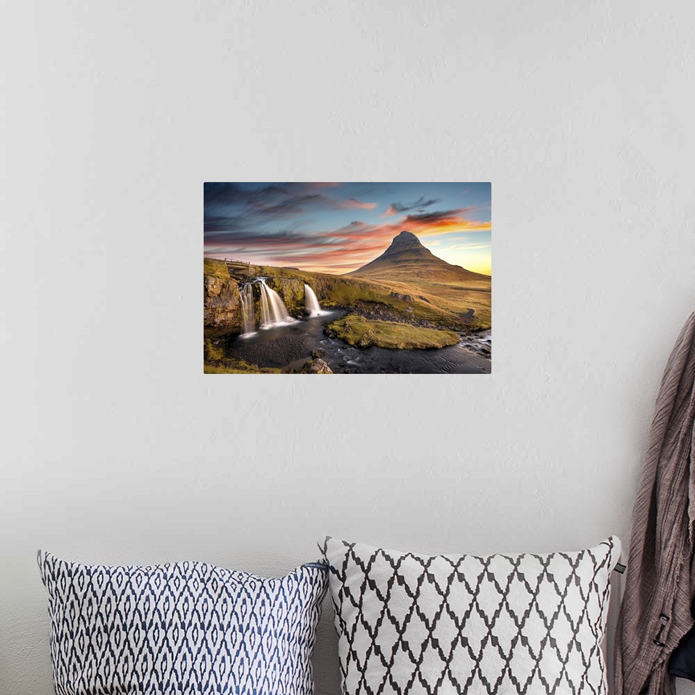 A bohemian room featuring Sunrise at Kirkjufell Mountain overlooking a small waterfall, Iceland, Polar Regions
